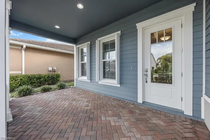 Property entrance featuring a patio