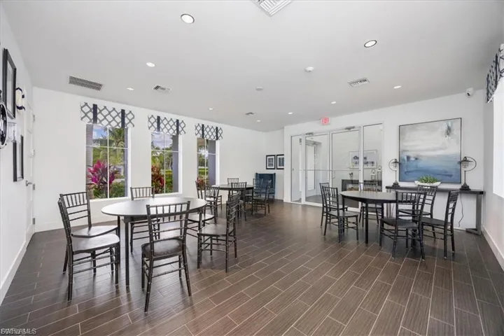 Dining area featuring recessed lighting and wood tiled floors