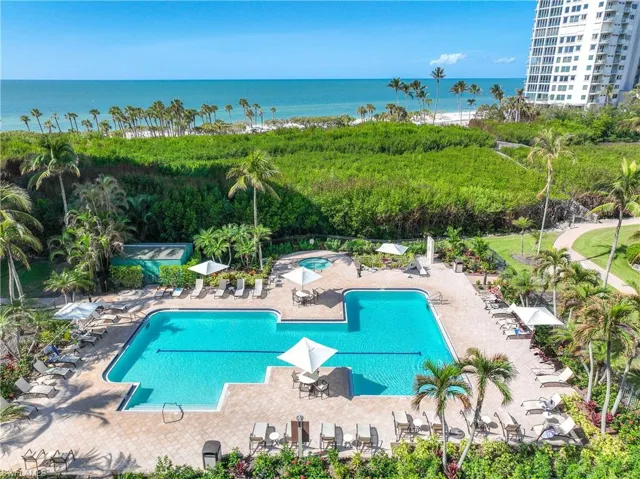 View of pool featuring a water view and a patio