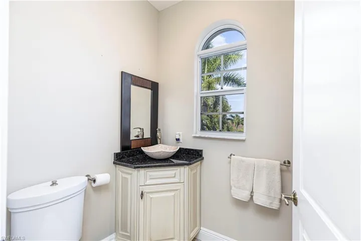 half bath for daily guest is bright and airy with 360 degree specialty toilet