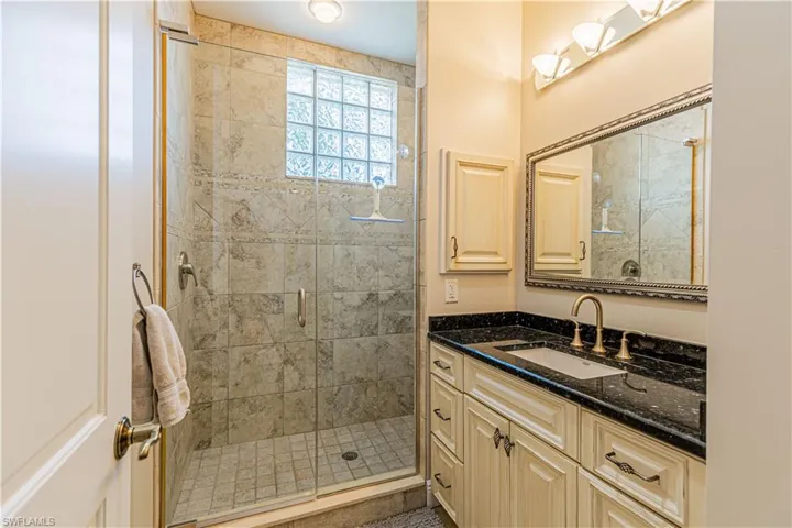 Guest bath does not disappoint! Upgraded cabinetry offers elegance to compliment the beautifully tiled shower