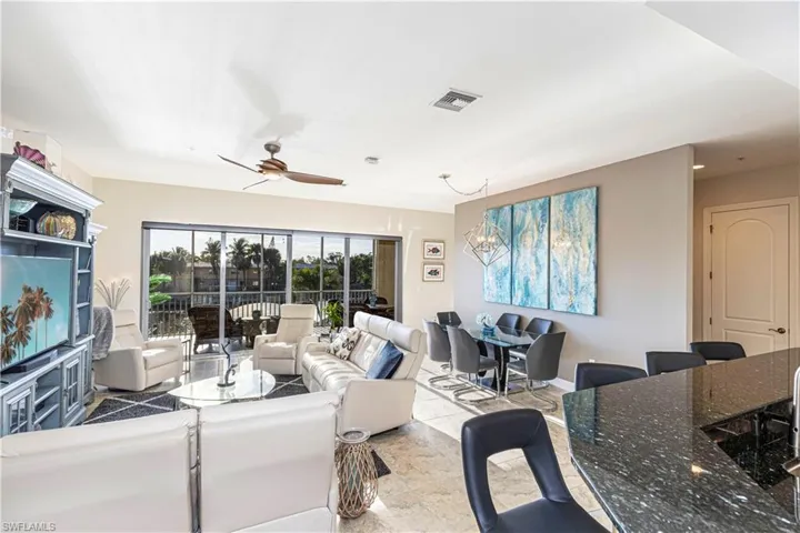 Living room and dining area offer huge water views on your 200ft canal