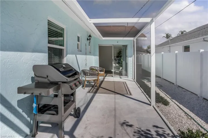 View of patio / terrace with fence and grilling area