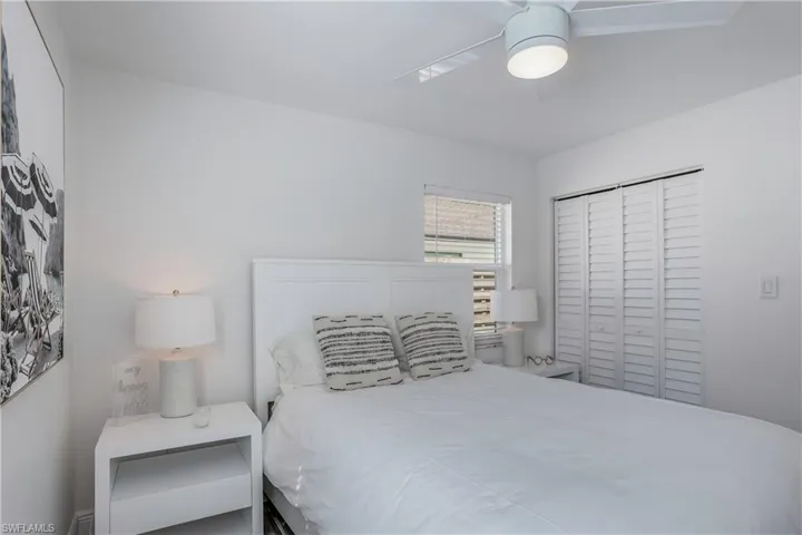 Bedroom featuring a ceiling fan and a closet