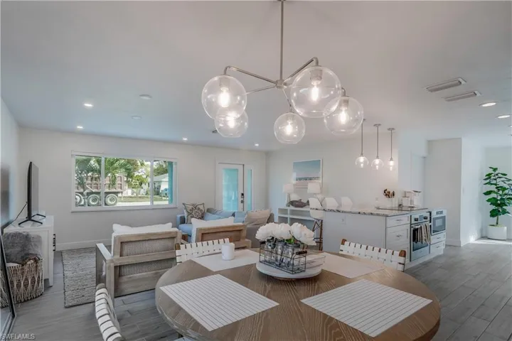 Dining space featuring recessed lighting, visible vents, baseboards, and wood finished floors