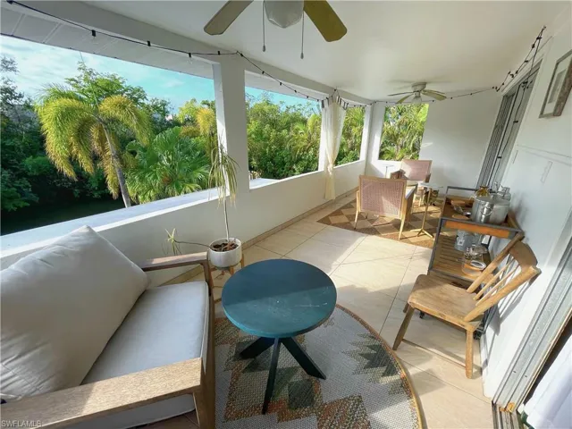 Sunroom featuring tile patterned flooring