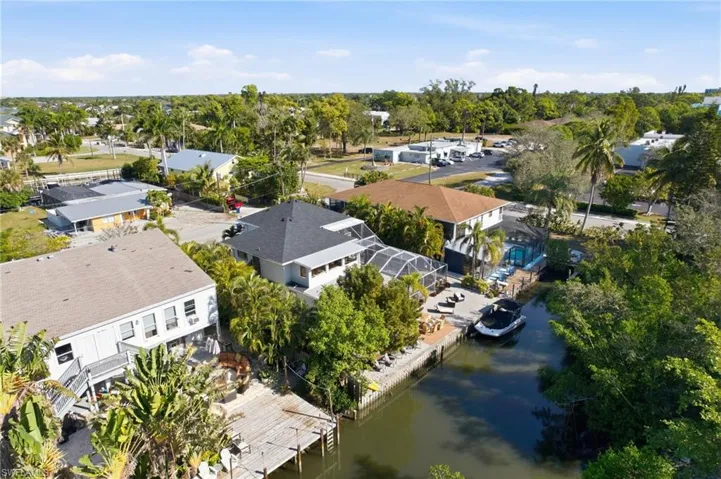 Aerial view of residential area featuring a large body of water