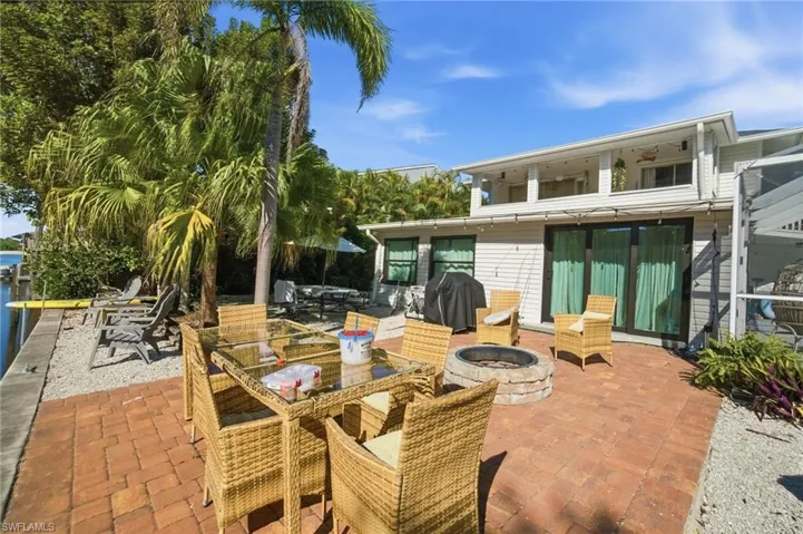 View of patio / terrace featuring an outdoor fire pit, grilling area, and outdoor dining space