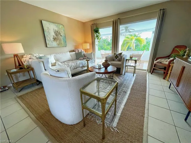 Living room with light tile patterned floors