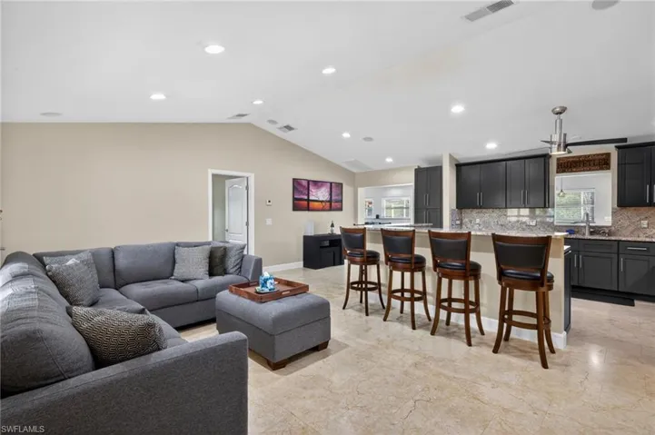 Living room with recessed lighting and baseboards