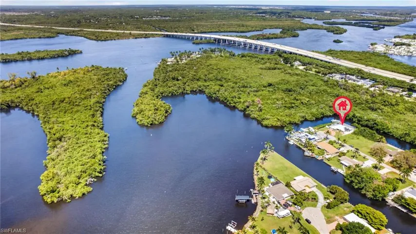 Drone / aerial view of a nearby body of water and a notable bridge