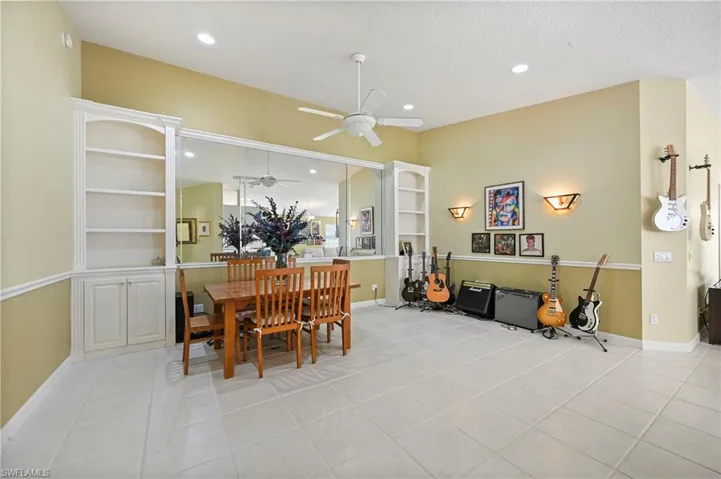 Dining space with light tile patterned floors, recessed lighting, and a ceiling fan