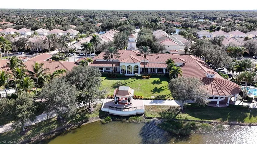 Aerial perspective of suburban area with a nearby body of water
