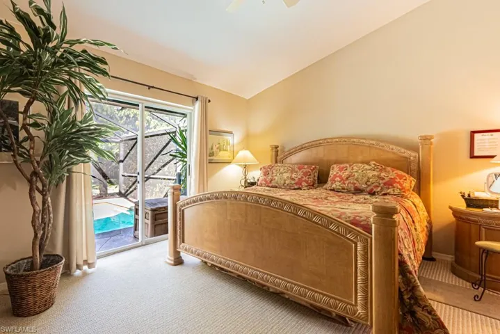 Bedroom featuring access to outside, carpet, lofted ceiling, and ceiling fan