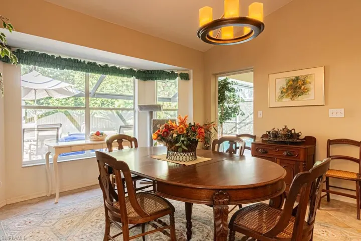 Dining space featuring baseboards and light tile patterned floors