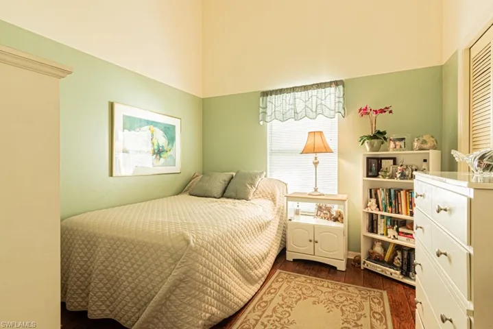 Bedroom featuring dark wood-type flooring