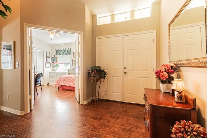 Foyer featuring dark wood finished floors and ceiling fan