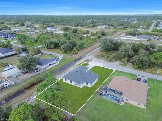 Aerial perspective of suburban area with property parcel outlined