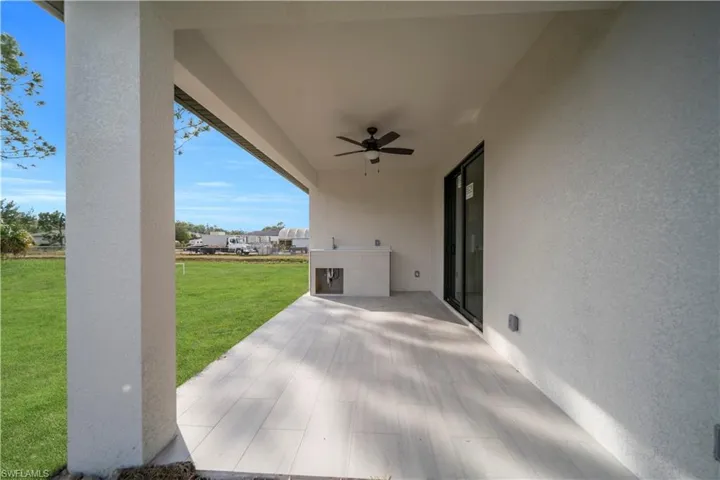 View of patio featuring a ceiling fan