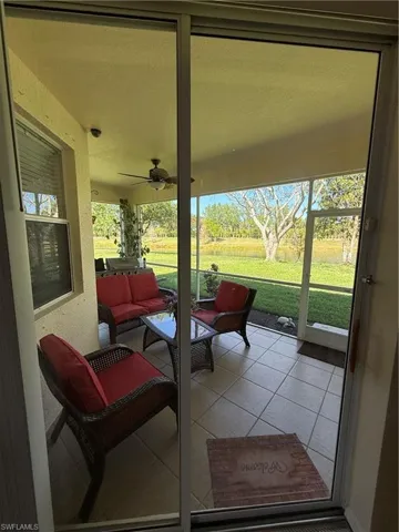 Sunroom / solarium featuring an outdoor living space, plenty of natural light, and ceiling fan