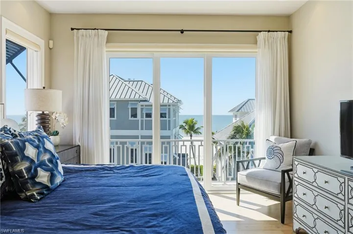 Bedroom featuring wood finished floors and access to outside
