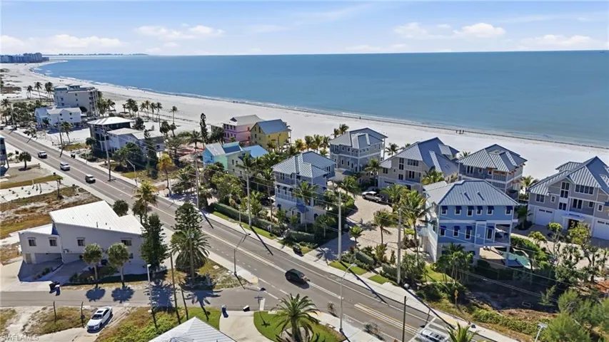 Aerial perspective of suburban area featuring unending shoreline