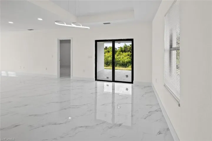 Spare room featuring light tile flooring