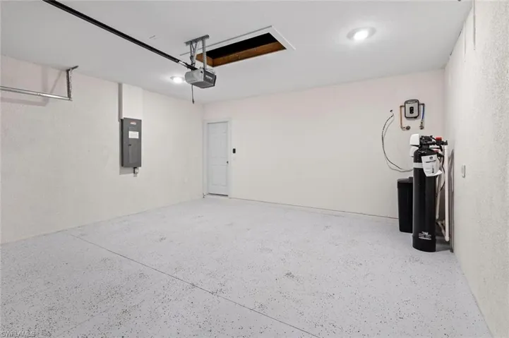 Garage featuring a garage door opener