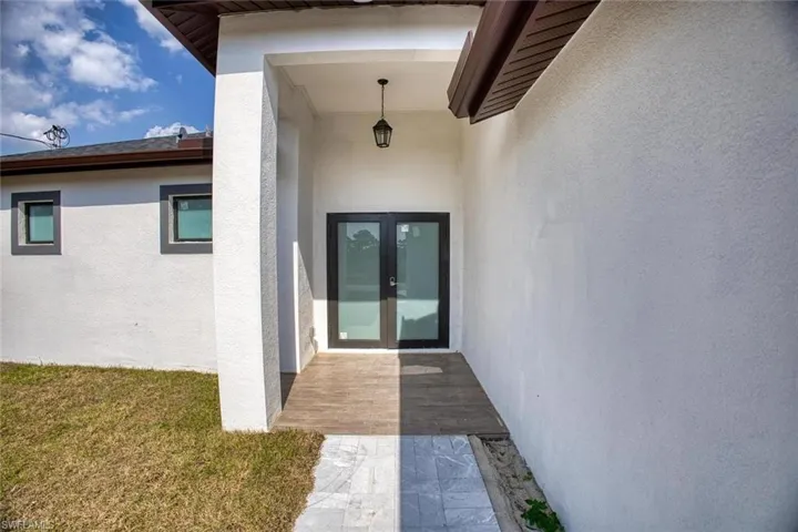 Doorway to property with french doors