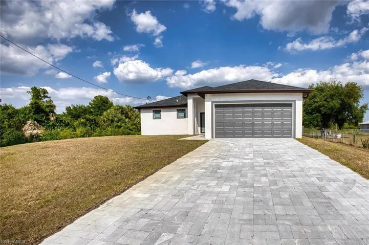 View of front of property with a front yard