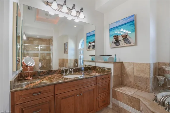 The master bath is very spacious and features new granite counters