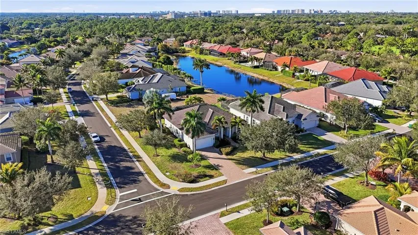 Home sits on a pond in this premier North Naples community