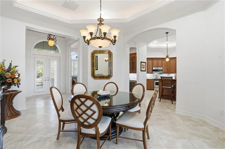 The formal dining space features tray ceilings with custom lighting and can be used for dining or living space