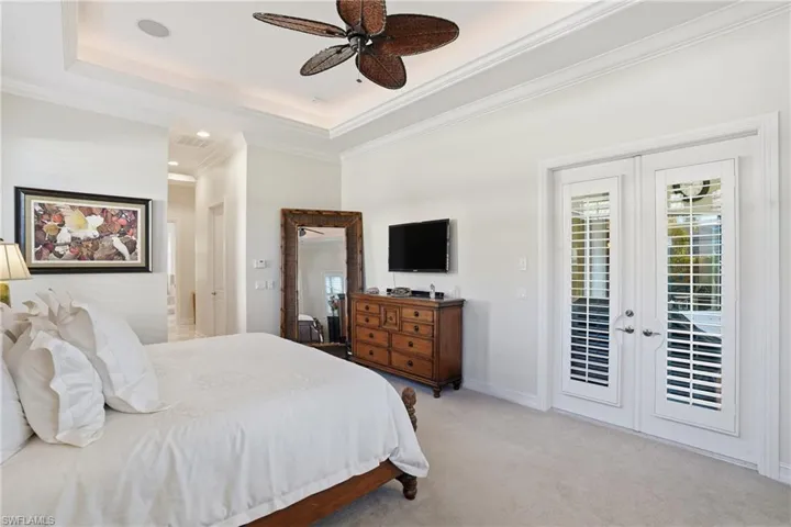 Spacious Master with French doors leading to the lanai and pool/spa area