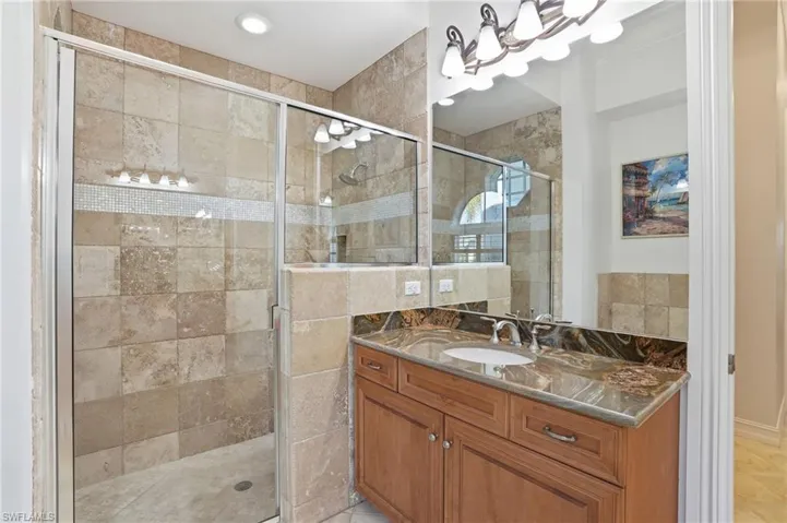 the Master bath features two vanities, walk in shower, a separate tub, and private water closet