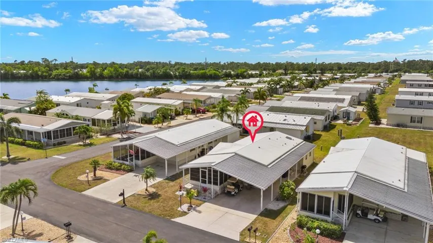 Birds eye view of property featuring a residential view and a water view