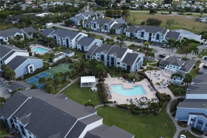 Aerial view of property's location with nearby suburban area