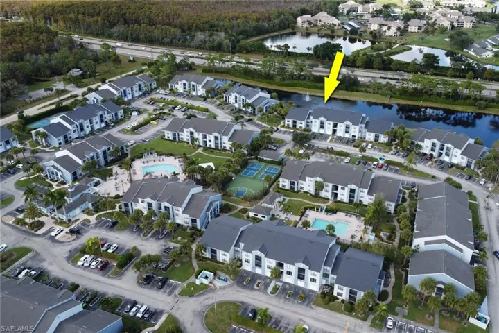 View of property location with a large body of water and a pool area