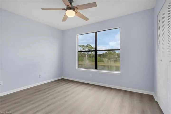 Spare room featuring light wood-style floors and a ceiling fan