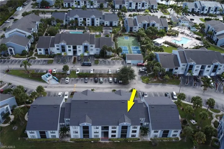 Aerial view of property and surrounding area with a pool