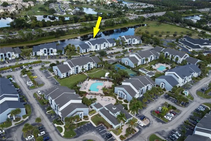 Aerial overview of property's location with a large body of water