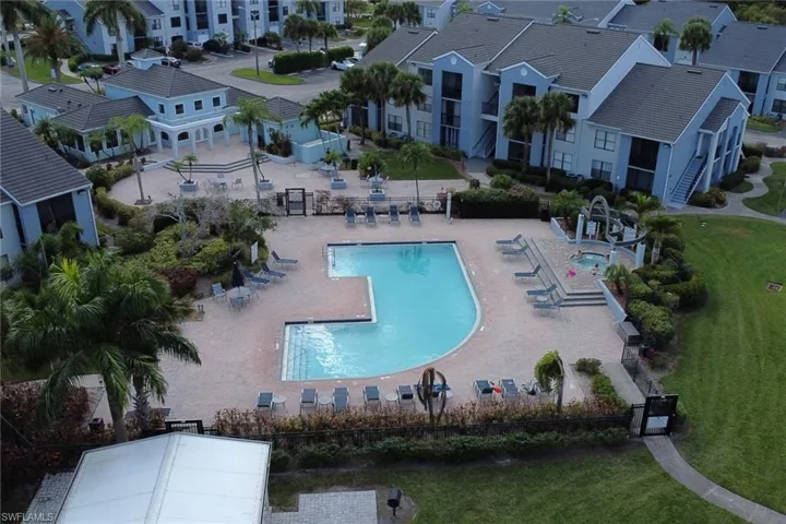 Community pool with a patio