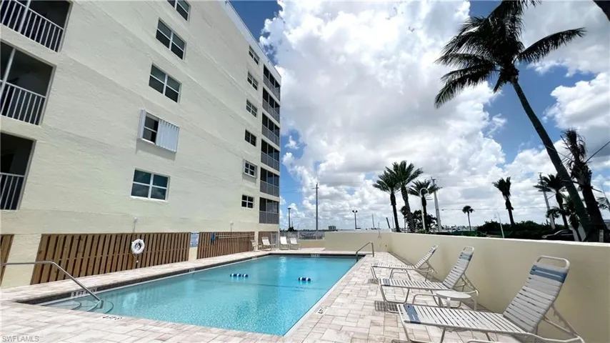 Community pool featuring a patio area