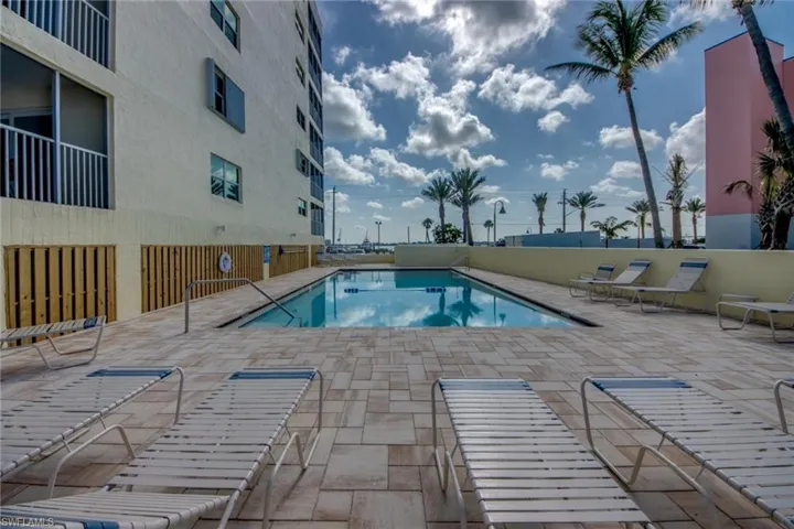 Community pool featuring a patio area