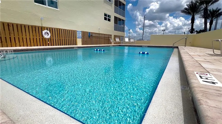 Community pool featuring a patio