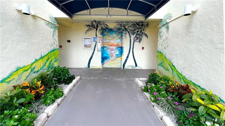View of exterior entry with stucco siding