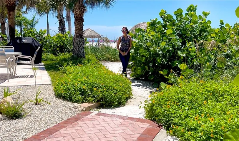 View of garden beach path along the back of the property, near BBQ patio