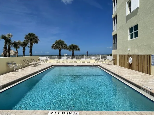 Community pool featuring a patio area