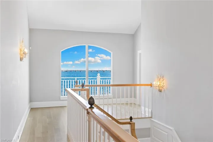 Hallway featuring a water view and light wood finished floors