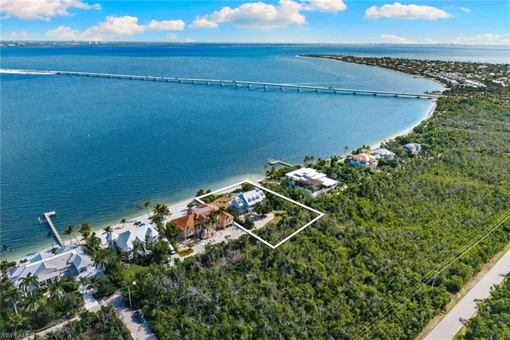Aerial view of property's location featuring a notable bridge, property boundaries highlighted, and a large body of water